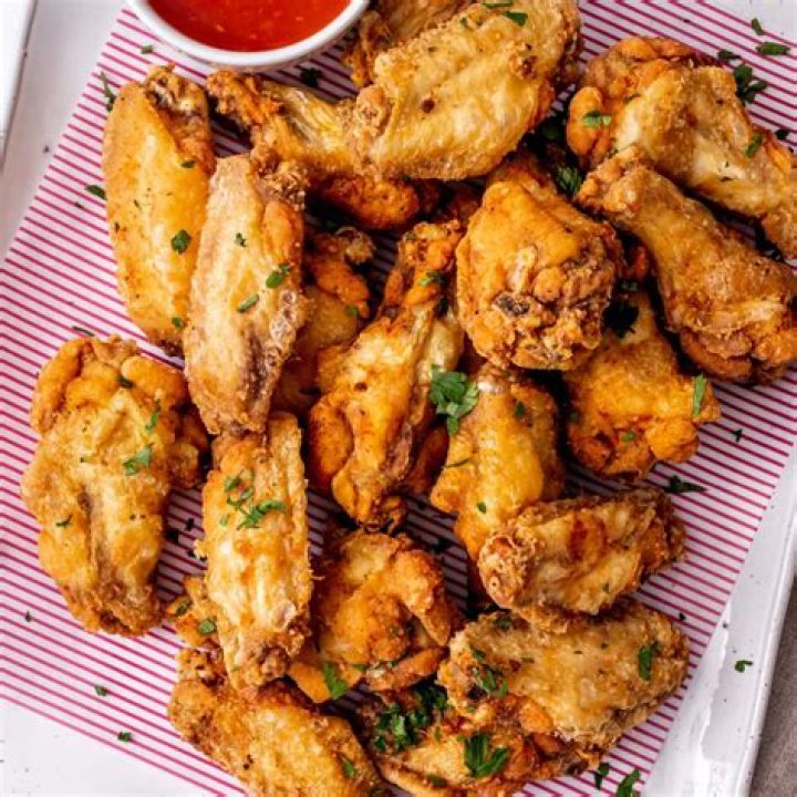 Are Domino’s wings fried or baked?