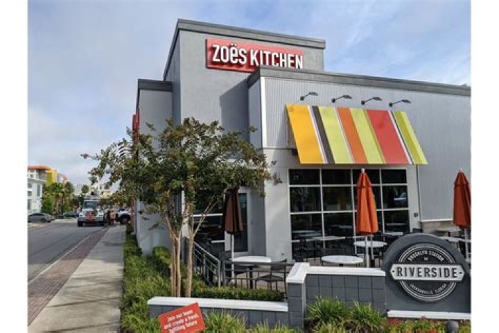 Does Cava own Zoës Kitchen?