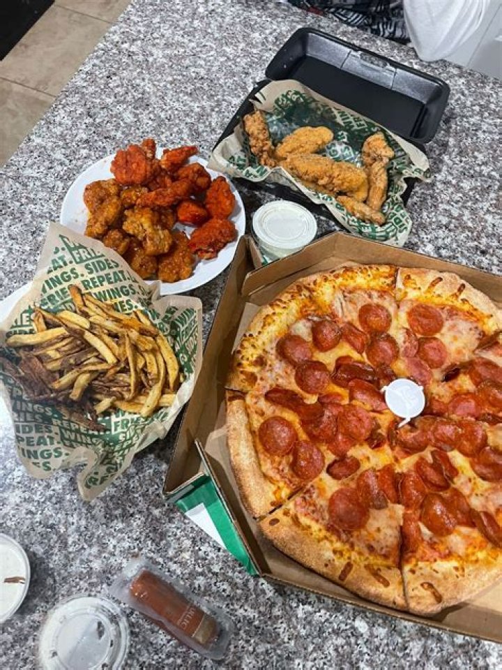 Does Pizza Hut own Wingstop?