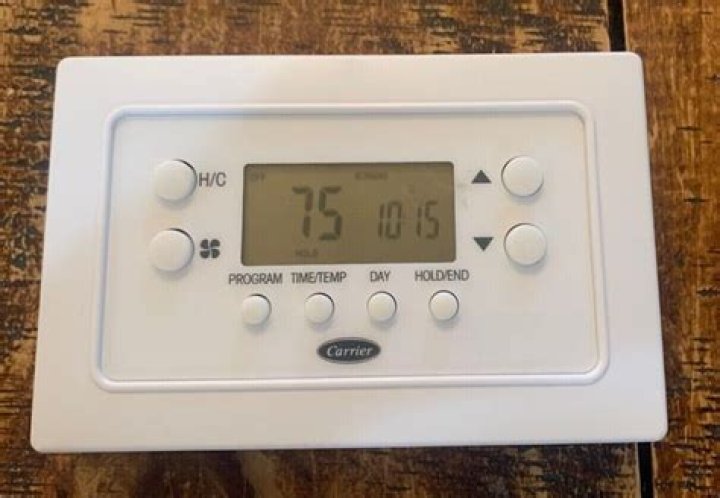 How do I reset my carrier thermostat?