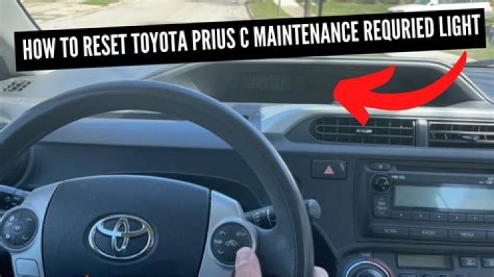 How do I turn off the maintenance required light on my Toyota Prius?