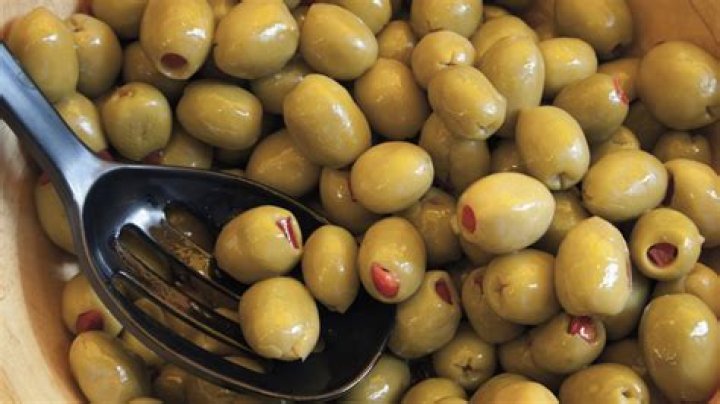 How do they put pimentos in green olives?
