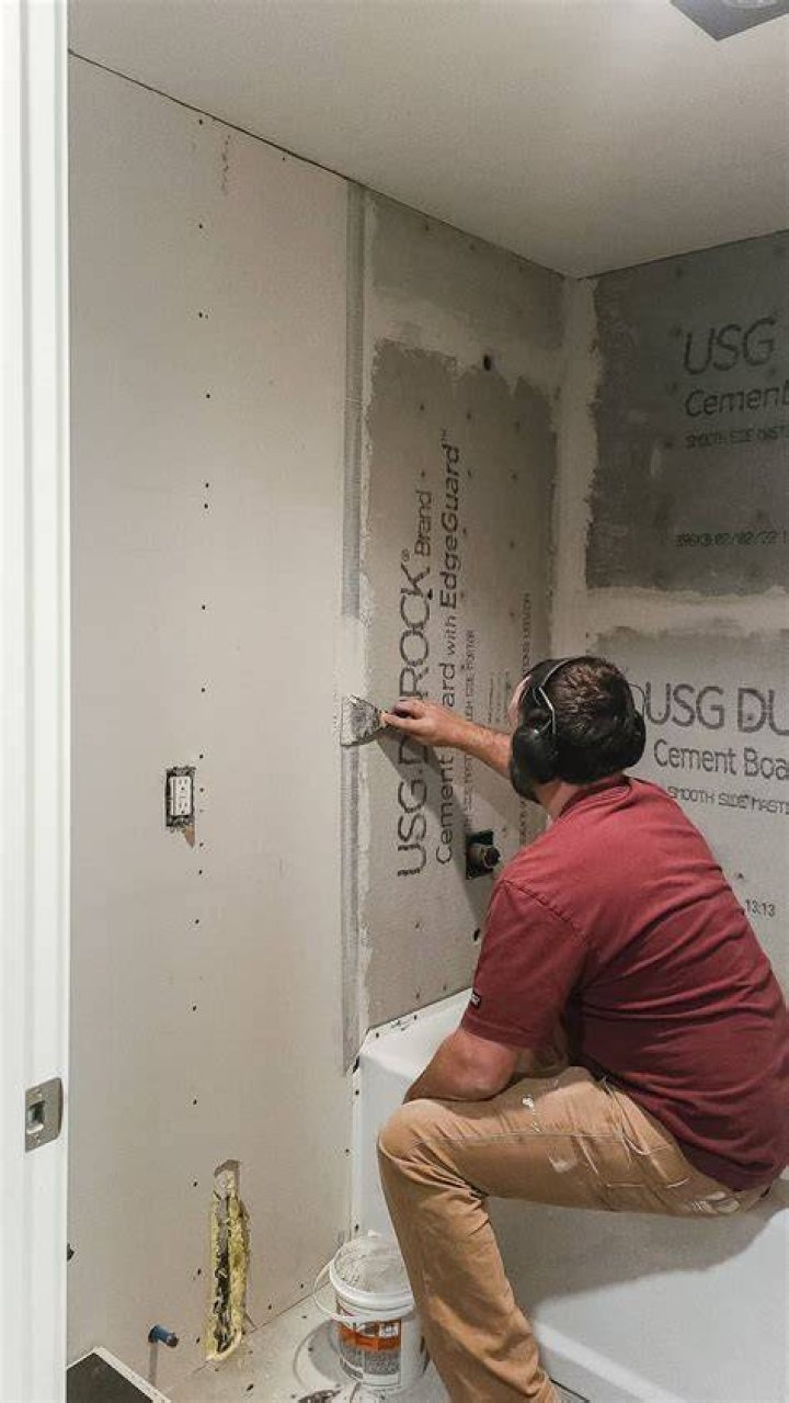 How do you attach mesh tape to cement board?