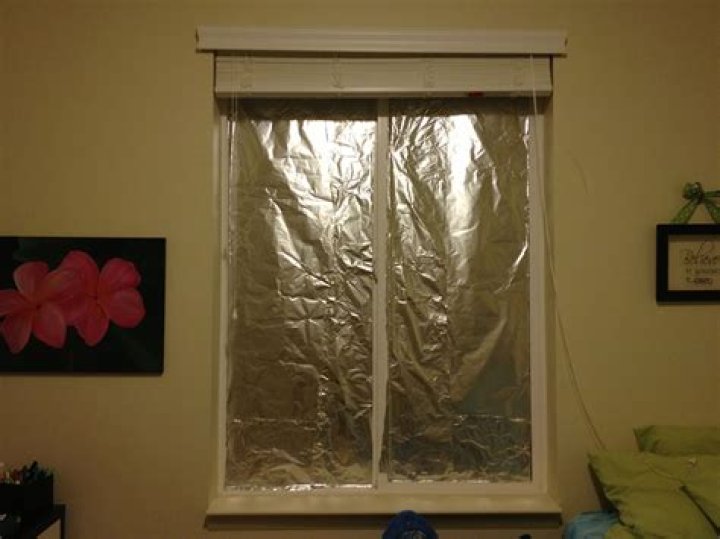 How do you blackout windows with aluminum foil?