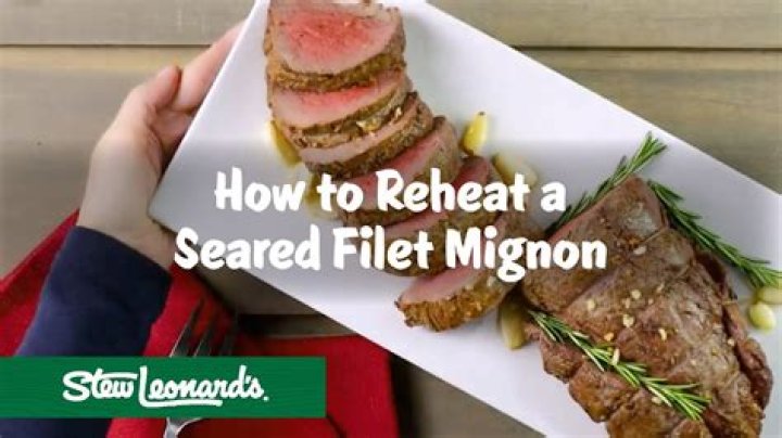 How do you reheat filet mignon without overcooking it?