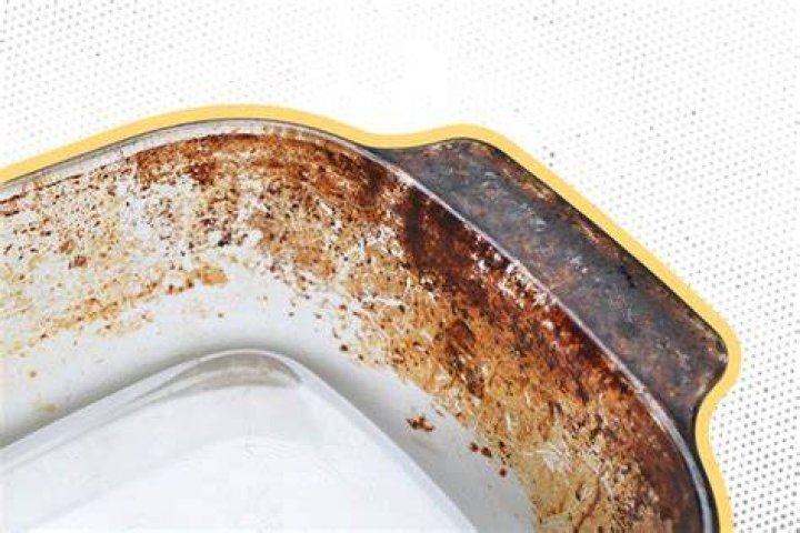 How do you remove brown stains from glass bakeware?