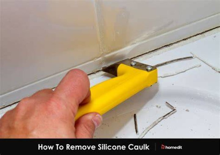 How do you remove excess silicone caulk?