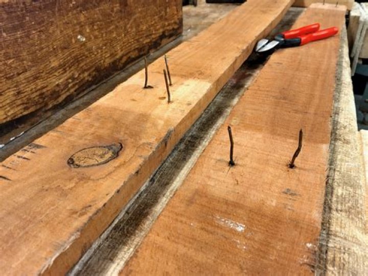 How do you remove nailed wood?