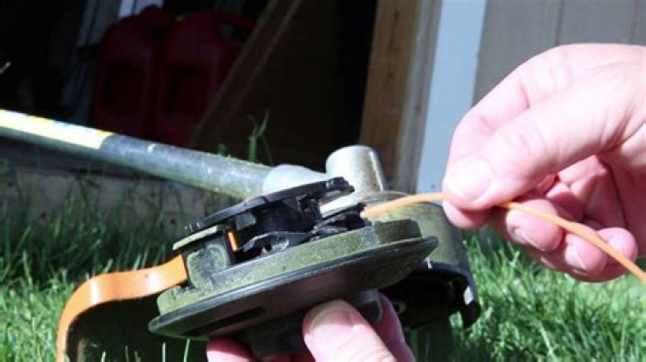 How do you restring a Stihl FS 56 trimmer?