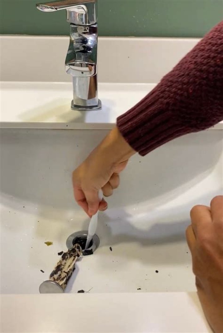 How do you unclog a urinal?