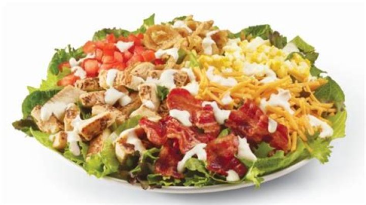 How many calories are in a half Caesar Parmesan salad from Wendy’s?