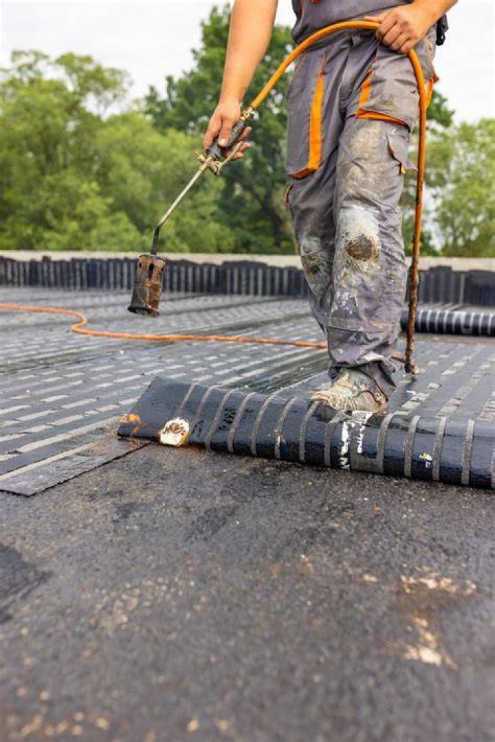 How much does it cost to replace a torch down roof?