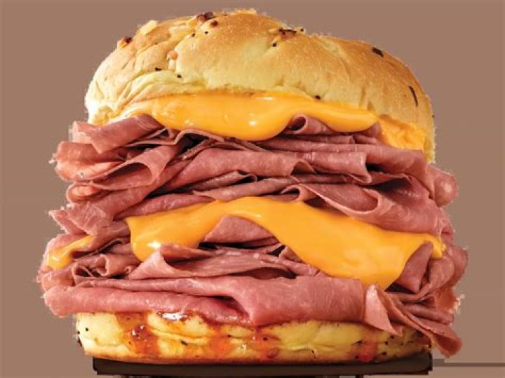 How much is a half pound beef and cheddar at Arby’s?