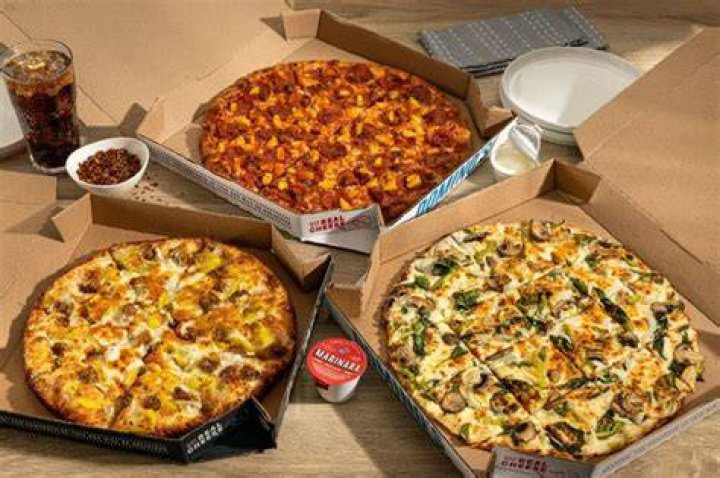 What are Domino’s specialty pizzas?