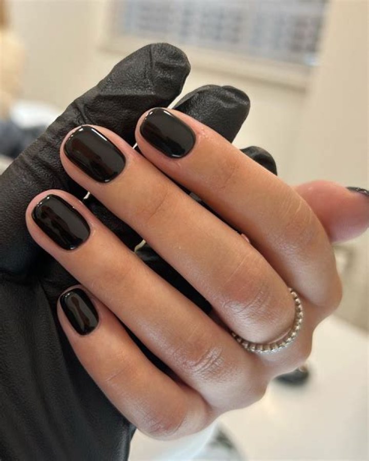 What do black painted nails mean?