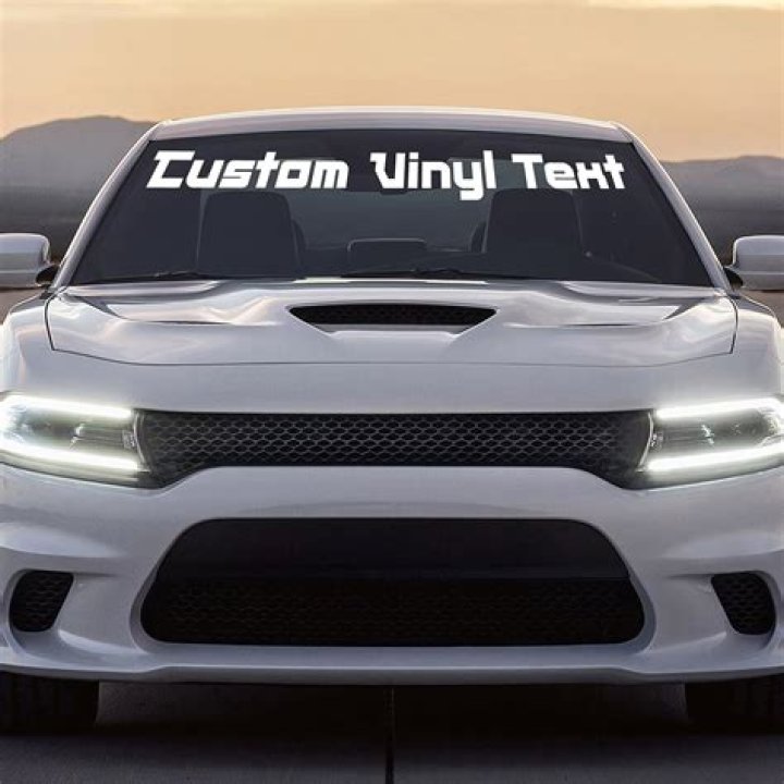 What do the white stickers with numbers on cars mean?