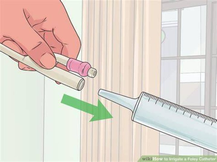 What do you flush a Foley catheter with?