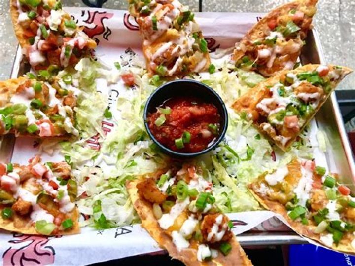 What does Tijuana Flats put on chips?