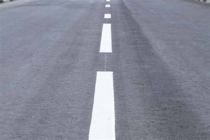 What does white line on sidewalk mean?