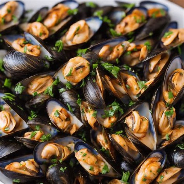 What is the proper way to eat mussels?