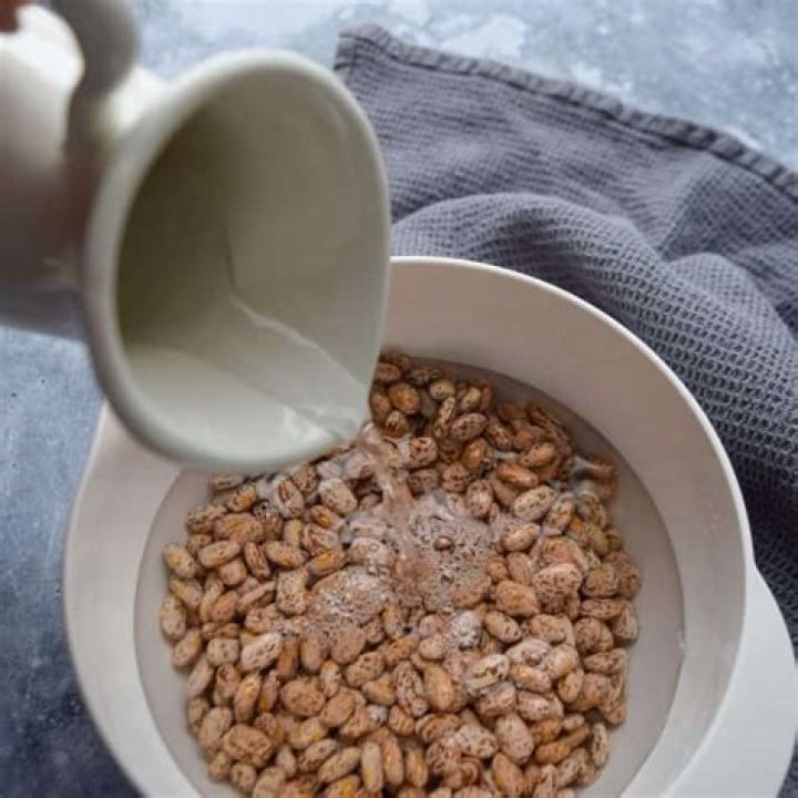 What is the purpose of soaking beans overnight?