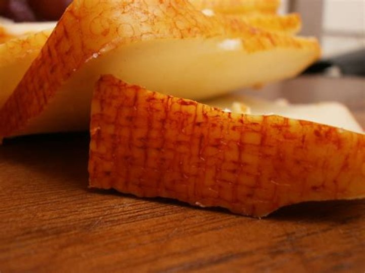 What is the red coating on Muenster cheese?