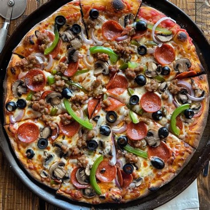 What is usually on a supreme pizza?
