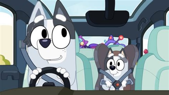 What song does Andy sing in the car with Jim?