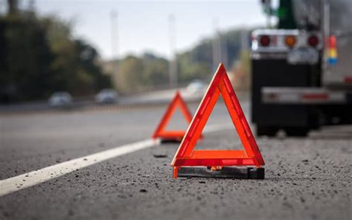 Where do you place emergency triangles?