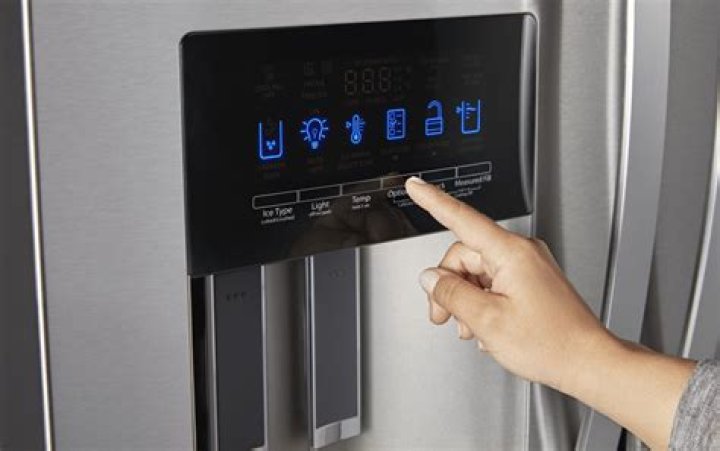 Where is the reset button on a GE Profile refrigerator?