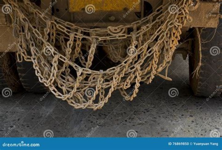 Why do some trucks have chains hanging?